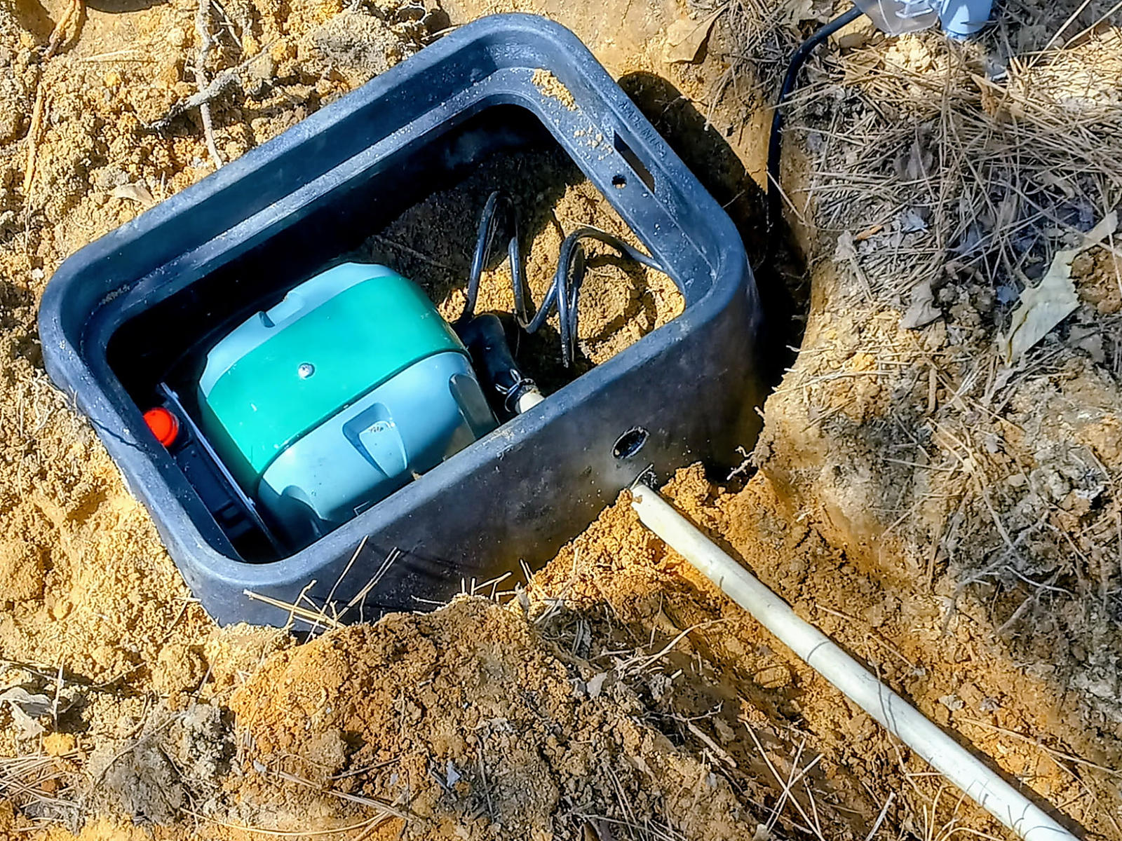 Aerator equipment inside a black protective enclosure with its cover removed in Brookwood
